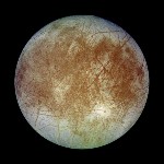 Circular moon with ice set against a black sky